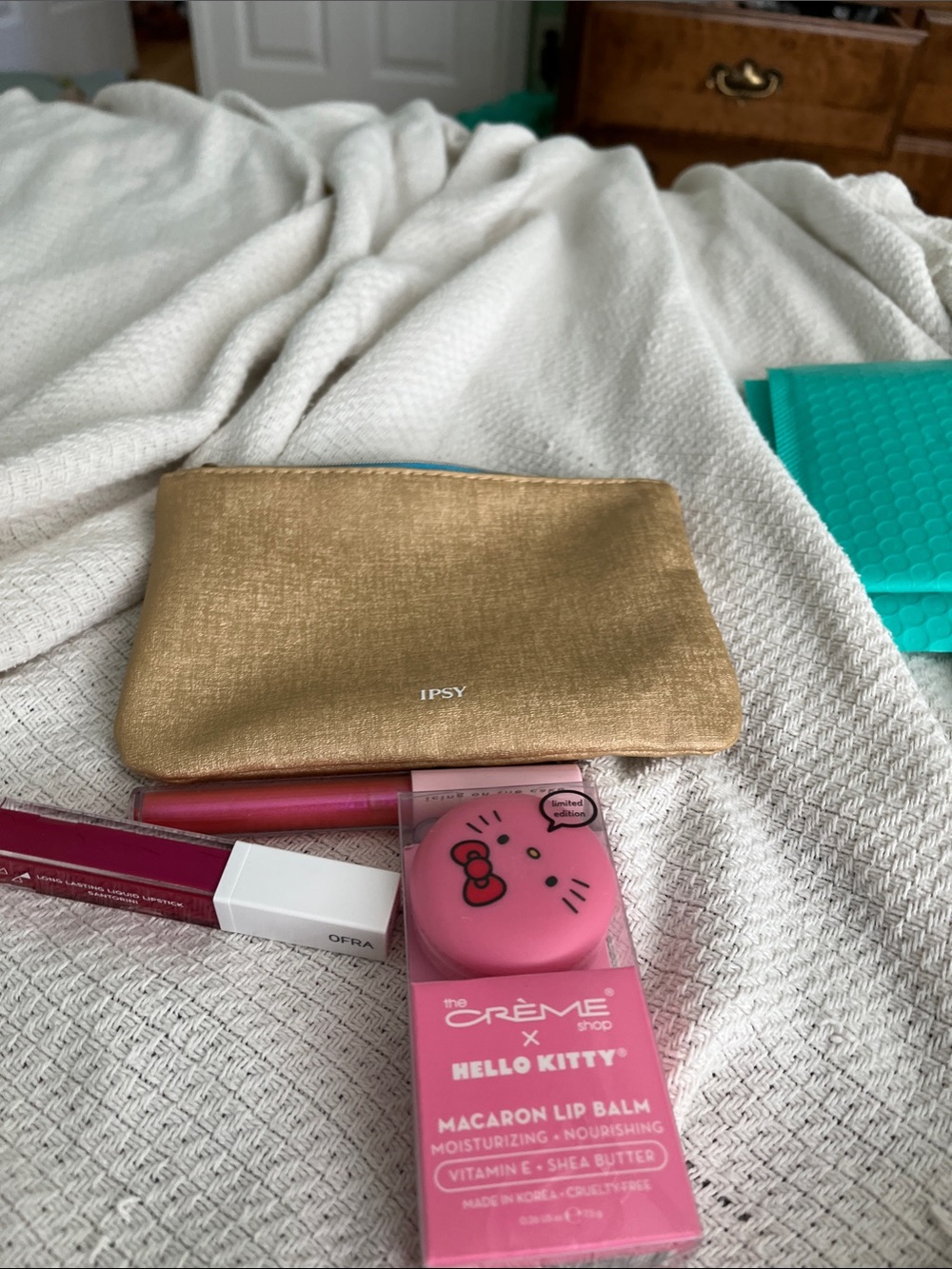ipsy Gold Cosmetic Pouch with Pink Hello Kitty Lip Balm and Lip Gloss